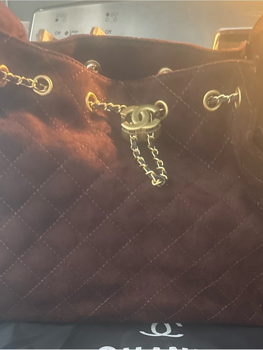 Brown Quilted Drawstring Shoulder Bag in Deep Brown with Gold Hardware